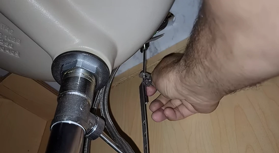 small repairs in Rochester NY: checking a sink drain trap for leaks