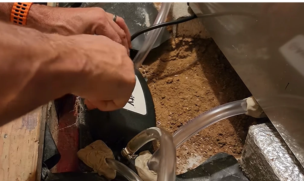 home maintenance in Rochester NY: hose connection during a water heater flush